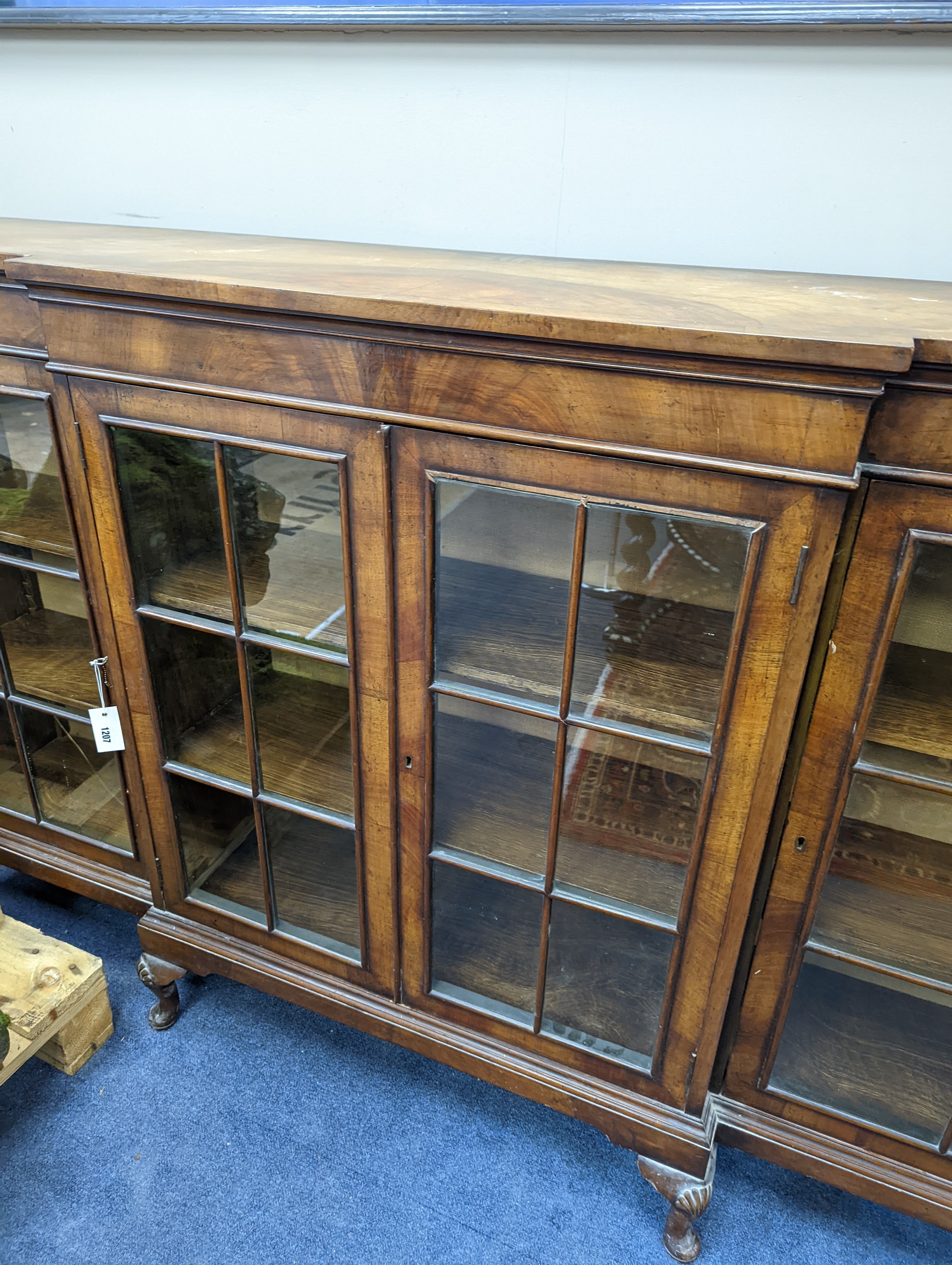 A Queen Anne revival walnut dwarf breakfront bookcase, length 182cm, depth 38cm, height 113cm